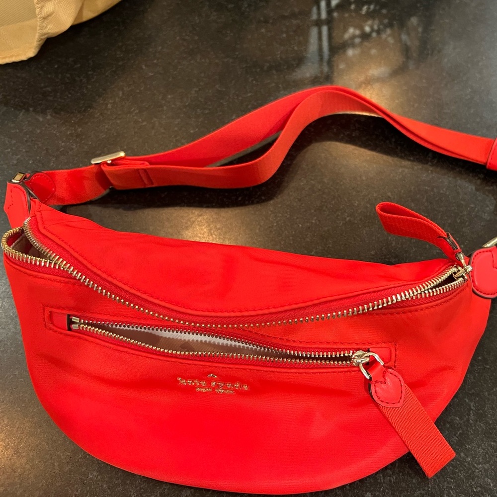 Red Kate spade belt bag.